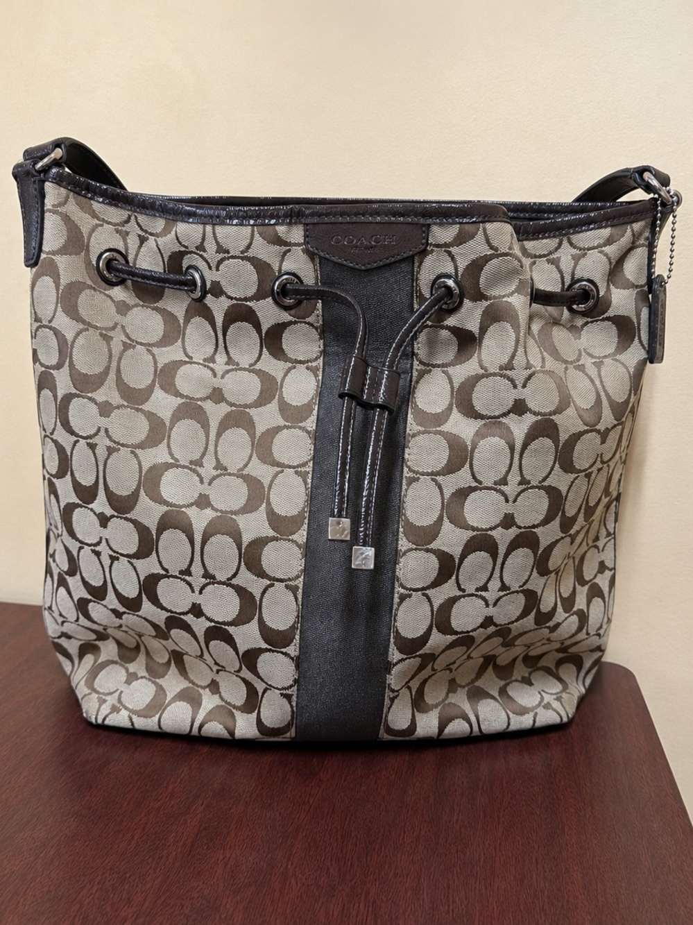 Coach Signature Canvas Drawstring Shoulder Bag in Brown and Cream